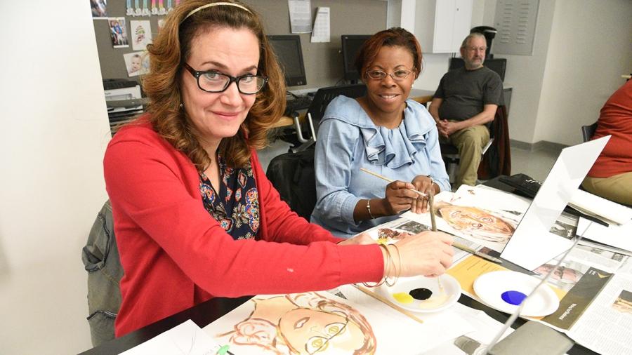 Janet Lombardi and Tracy Adams reate selfies the old-fashioned way.