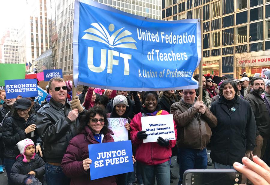 The UFT banner is held aloft at the New York City march.