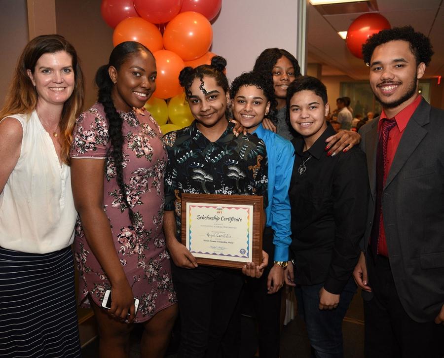 Teacher Jennifer Elliot (left) and student honoree Angel Caraballo (holding plaq