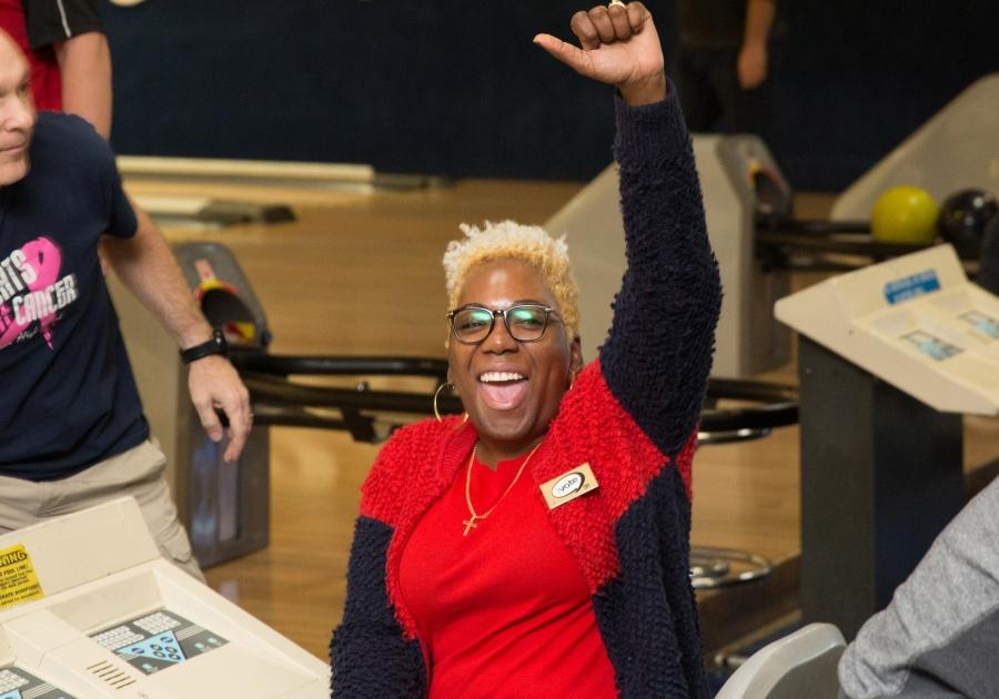 Woman cheers for bowling team