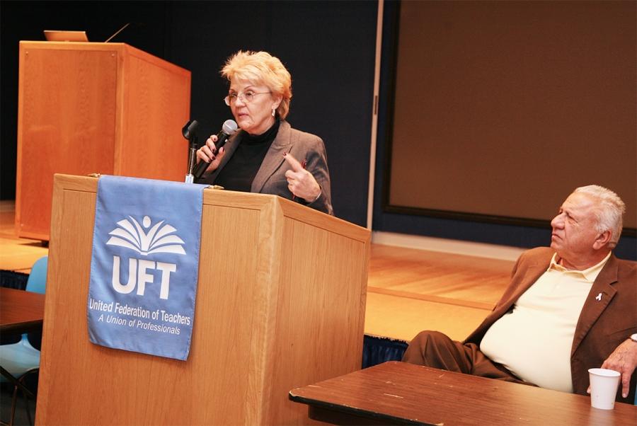Mature woman with a mic at a podium