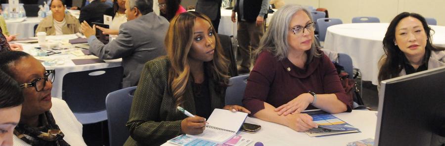 City Council members get information on NYC Childcare Navigator during a UFT mini “class” at the annual legislative breakfast.