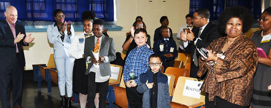 UFT President Michael Mulgrew (left), Chapter Leader Denise Huggins (second from