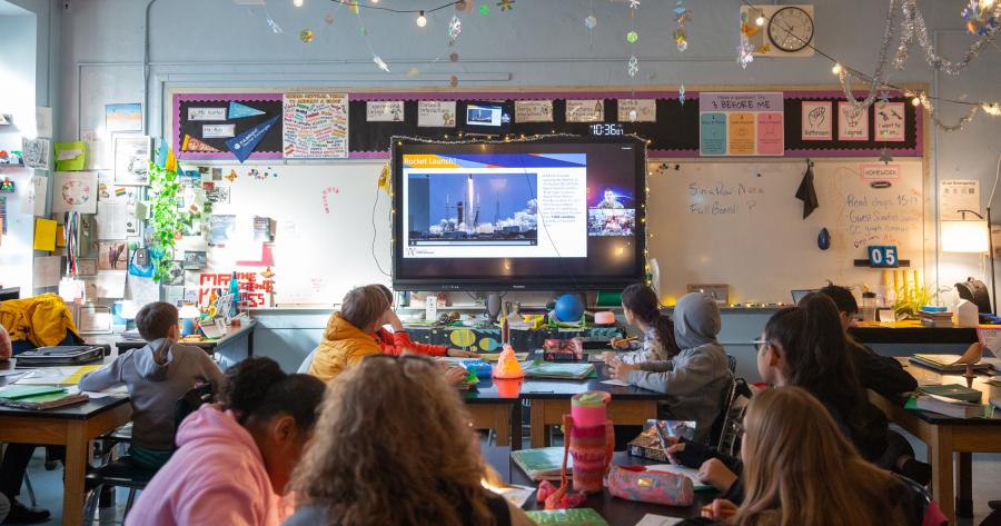 Students in Stephen Kos' science class at Manhattan's MS 245 engage in a virtual visit by technical sergeant with the U.S. Space Force. 