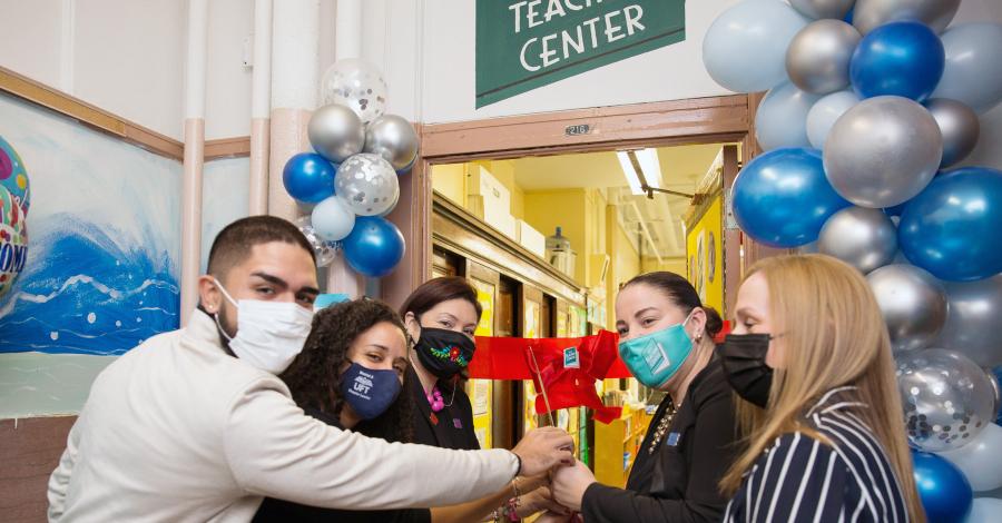 Doing the honors at the Longwood Academy of Discovery in the Bronx are (from left) state Assemblyman Kenny Burgos, Chapter Leader Stephanie Sangosse, Principal Victoria Najera, Teacher Center site coach Veronica Vadi and UFT District 8 Representative Karen Aldorando.