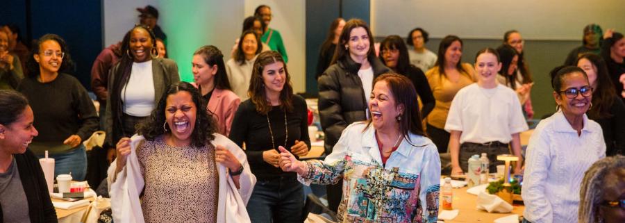 Early childhood educators get up and move as presenter Chris Keegan of CogniMoves leads them through a cognitive-motor activity to demonstrate a tool that helps students strengthen executive functioning skills.