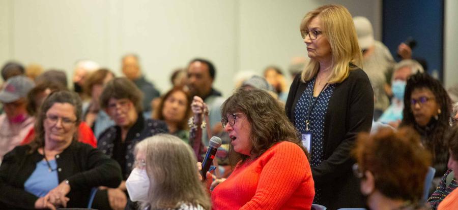 Retirees speaking at event