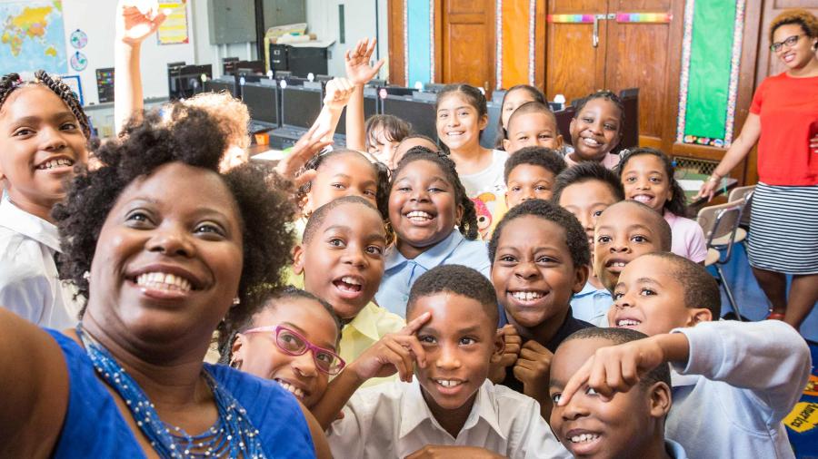Teacher and kids take a selfie