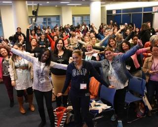 Educators enjoy a last stretch before heading to their chosen workshops.