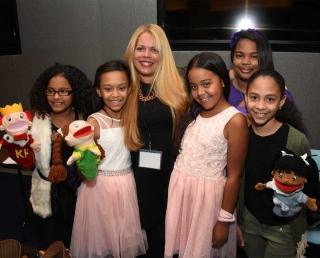 Alexandra Hernandez poses with her students from PS 25 in Williamsburg, Brooklyn