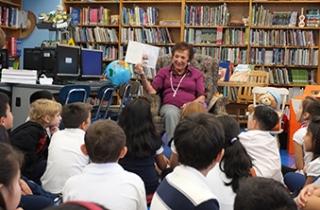 Sfiroudis reads to a class in the library at PS 229 in Woodside.
