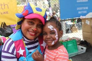 JJ the Clown gets a smile from Tamara, a student at PS 16 in Staten Island.