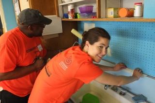 Brown (right) works on the renovation with Stanley Hamilton of Forest City Ratne