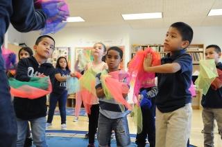 Secondgraders become colorful fish and swim to the music of Camille Saint-Saëns.