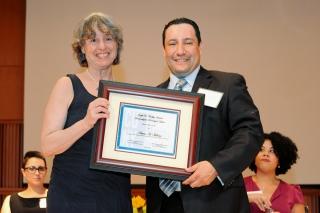 Molina receives his award from Prof. Ruth Milkman of the Murphy Institute