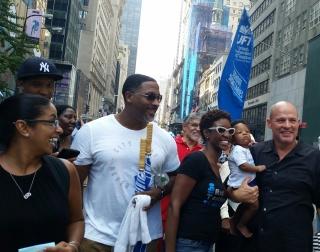 UFT President Michael Mulgrew (right) marches with members and their families.