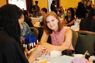 Elizabeth Soden, at PS 104 in Brooklyn, has her nails done by a student