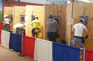 Students run electrical conduits and circuit breakers in the electrical installa