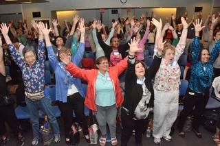 Retirees loosen up before heading off to the workshops.