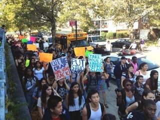 Students and staff rally outside the school on Oct. 2.