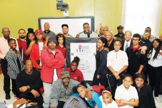 McIntosh with fathers, grandfathers, students and other family members at the ev