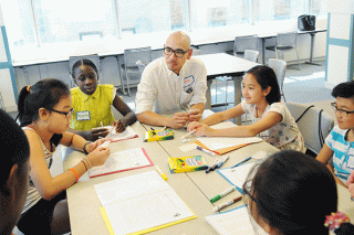 Jack Lee, a teacher at PS 1, leads an exercise.
