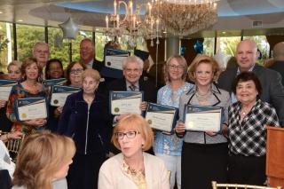 Seniors hold up awards