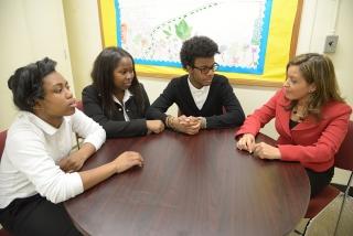 Guidance counselor Ingrid Paulino (right) discusses the virtual college fair the