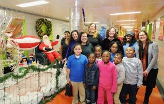 PS 335 1st-graders are led to their event .