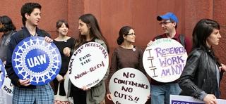 NYU graduate student employees and their supporters rally on campus last spring before delivering a petition demanding that the university restore cuts made to their health care earlier in the year.