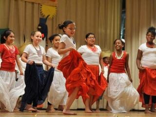 Third-graders perform a Puerto Rican dance.