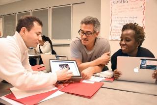 Paraprofessional Schneider Cardenas (left) of PS 196 in Brooklyn, teacher Fred W