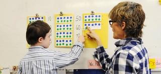 Seven-year-old Aedan counts his numbers by tens in Kreusch’s general education kindergarten class at PS 3 in the West Village.