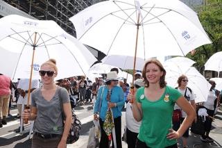 Maria Patterson  and Megan Moskop stay covered from the sun’s heat.