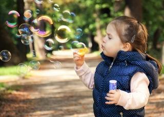 Preschooler blowing bubbles - generic