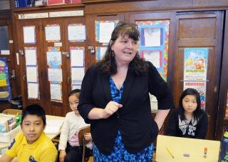 Teacher Kate O’Hagan presides over the classroom economy she has created using i
