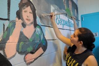 The mural on the third-floor stairwell begins to take shape.