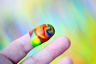 Rainbow paint on a finger