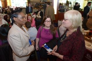 UFT District 15 Representative Patricia Atia (right) welcomes Melinda Jones (lef