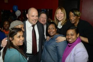 PS 26 staffers gather round Mulgrew at the close of this remarks.