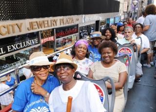 Retirees pack the top deck of their tour bus.