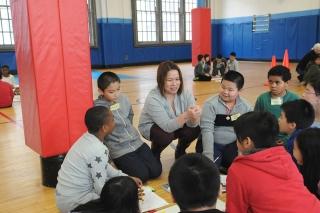 Teacher Mafan Gong leads 5th-graders in a debate about Billy the Kid’s motives, 