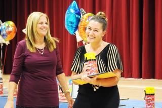 Gabriella Laskaris (right) is all smiles after picking up her tokens of recognit