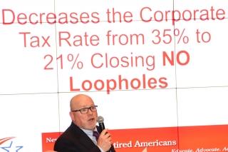 Man stands in front of slide show