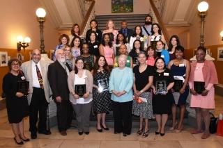 The honorees gather for a group shot with the schools chancellor and UFT officia