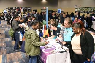 It’s a busy morning at the conference exhibit hall, where educators looked for f