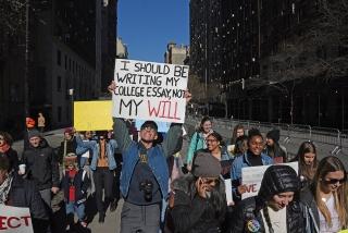 A student at the New York City march makes a point about gun violence. 