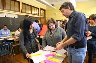 Lincoln HS history teacher Jackie Arellano (left) and English teachers Kelly Ritchie and Michael Keaney compare notes.