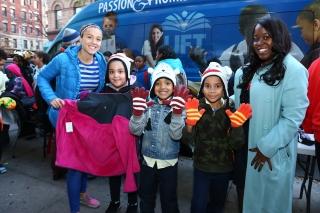 Kappa IV 2nd-graders, flanked by Fischer (left) and Burton-Myrick, model the mit
