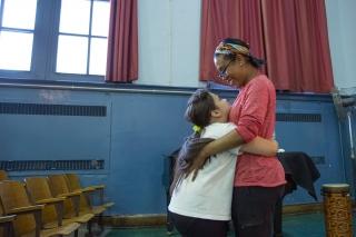 Hugs and serious discussions are all in a day's work for dance teacher Rashamell
